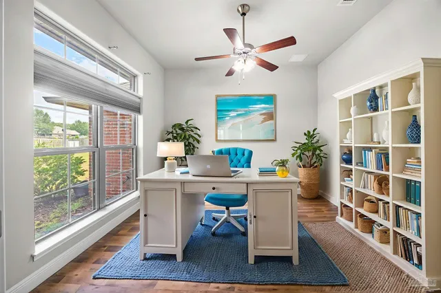 a workspace with furniture and a potted plant