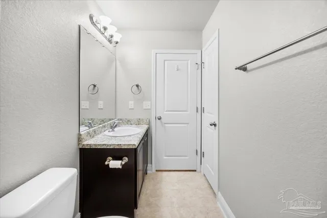 an empty room with large windows