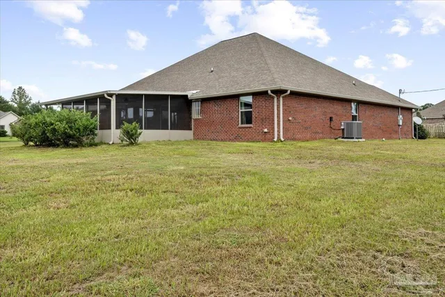 a view of a house with a yard and garage