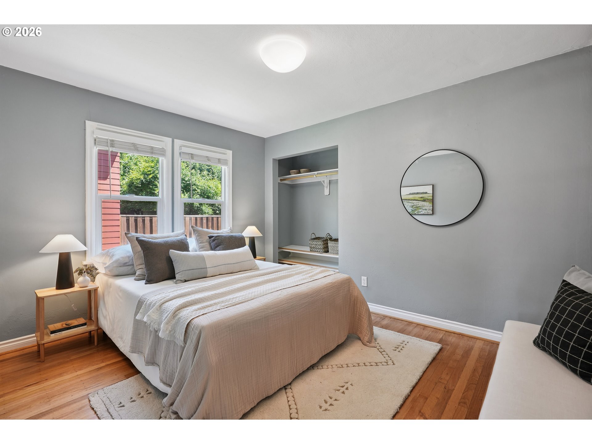 6406 Southeast 45th Avenue Portland, OR 97206 - Photo 16 of 39 a bedroom with a bed a mirror and a window