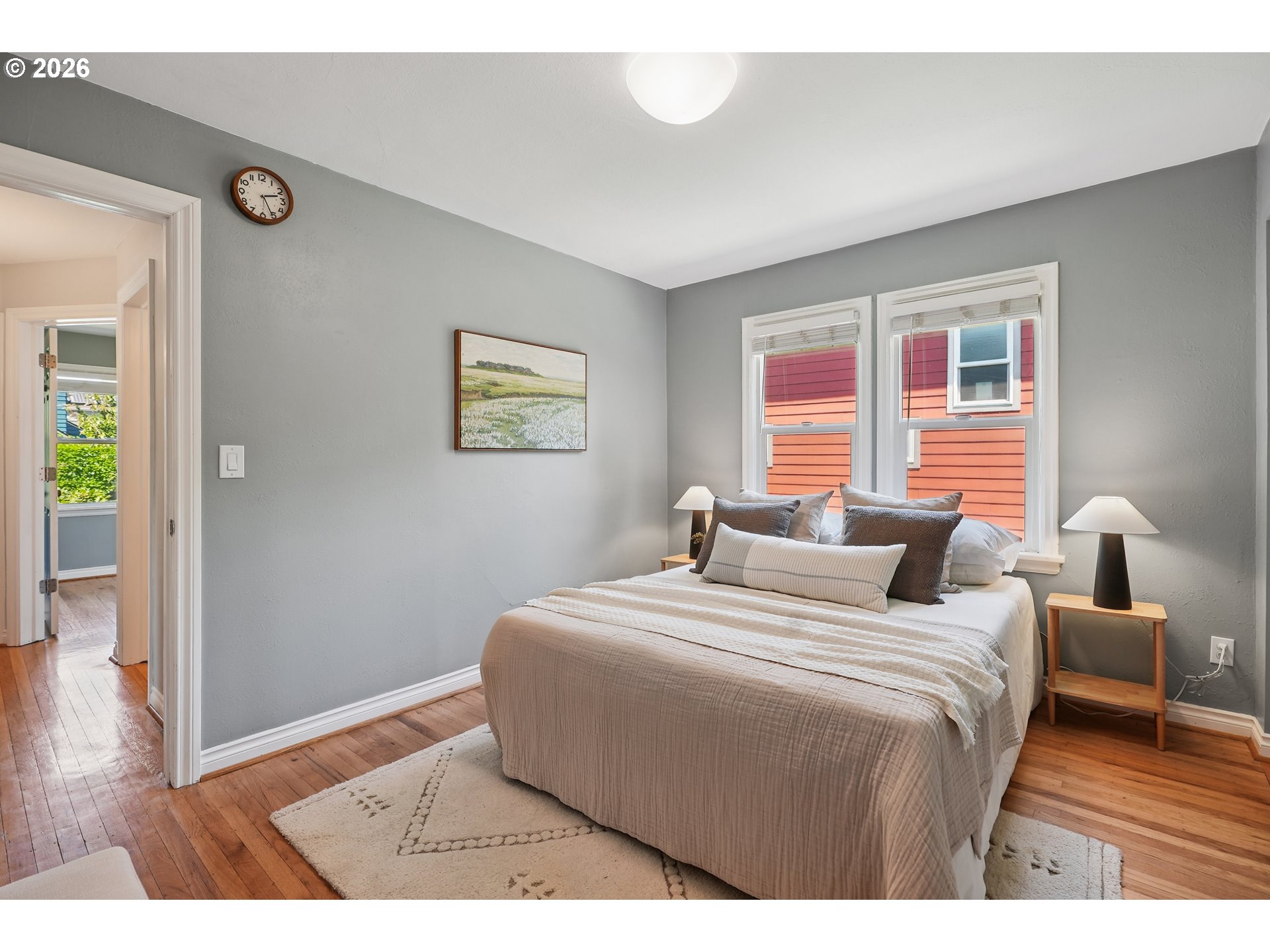 6406 Southeast 45th Avenue Portland, OR 97206 - Photo 17 of 39 a bedroom with a bed wooden floor and window