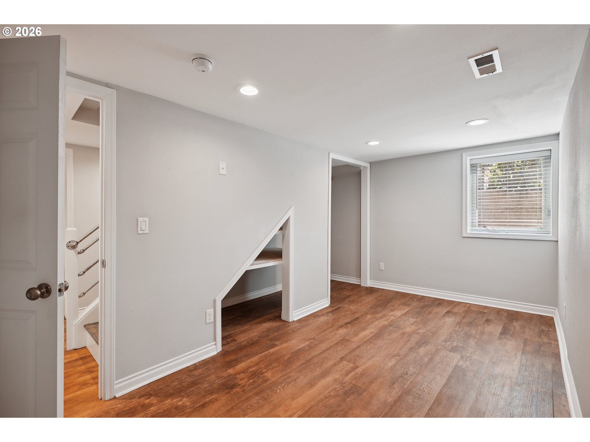6406 Southeast 45th Avenue Portland, OR 97206 - Photo 24 of 39 a view of an empty room with wooden floor and a window