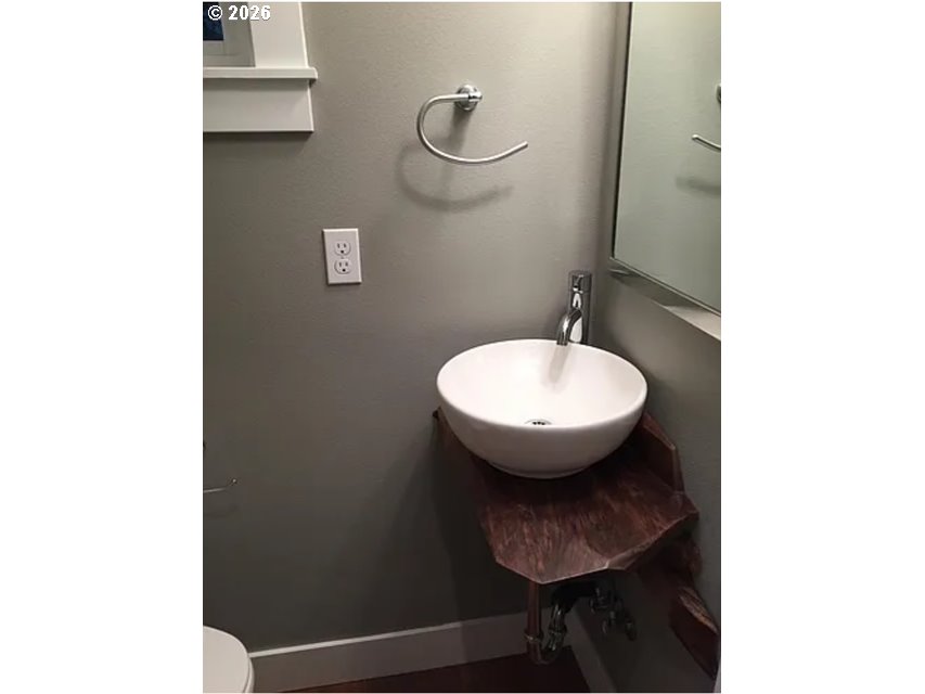 6406 Southeast 45th Avenue Portland, OR 97206 - Photo 34 of 39 a bathroom with a sink toilet and a mirror