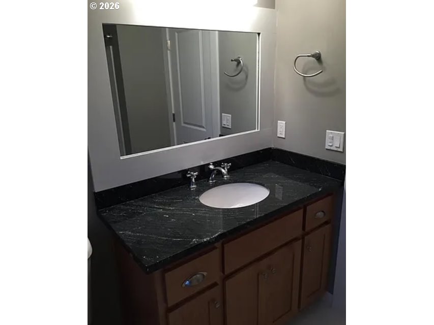 6406 Southeast 45th Avenue Portland, OR 97206 - Photo 36 of 39 a bathroom with a sink and a mirror