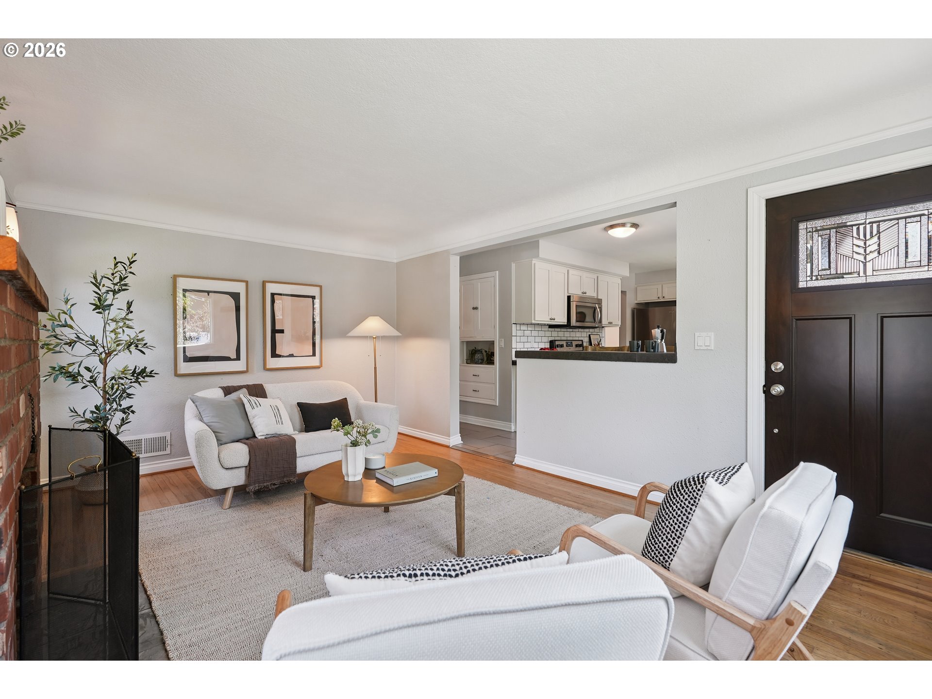 6406 Southeast 45th Avenue Portland, OR 97206 - Photo 4 of 39 a living room with furniture and a dining table with wooden floor