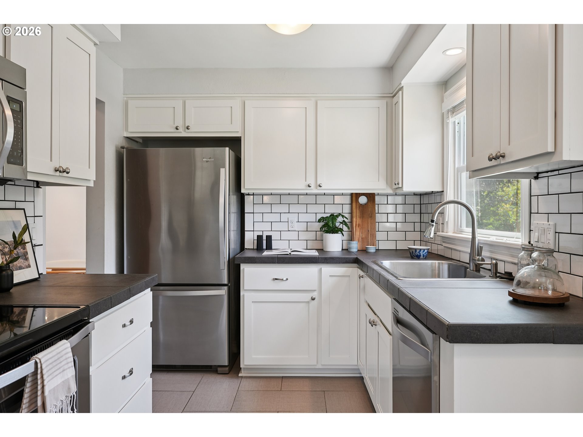 6406 Southeast 45th Avenue Portland, OR 97206 - Photo 6 of 39 a kitchen with granite countertop a sink stove and refrigerator