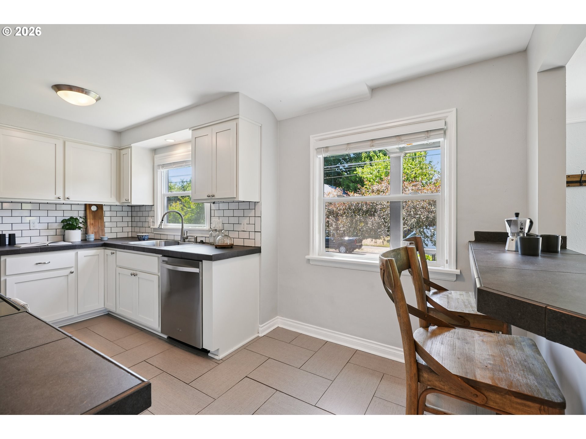 6406 Southeast 45th Avenue Portland, OR 97206 - Photo 7 of 39 a kitchen with a table chairs and a window