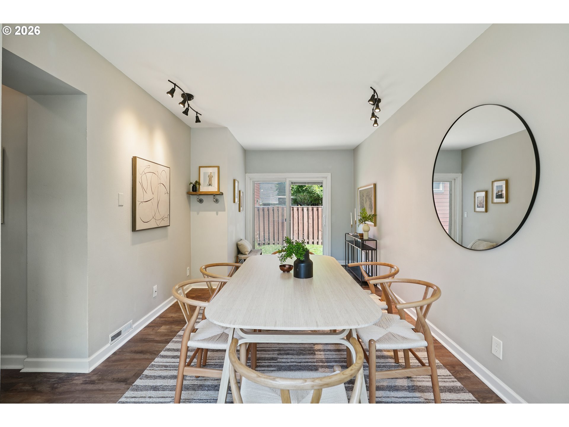 6406 Southeast 45th Avenue Portland, OR 97206 - Photo 9 of 39 a living room with a table a chandelier and couches