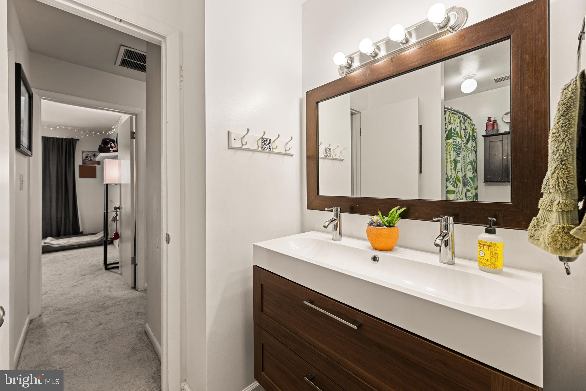 3671 Tavern Way Triangle, VA 22172 - Photo 11 of 18 a bathroom with a sink and a mirror