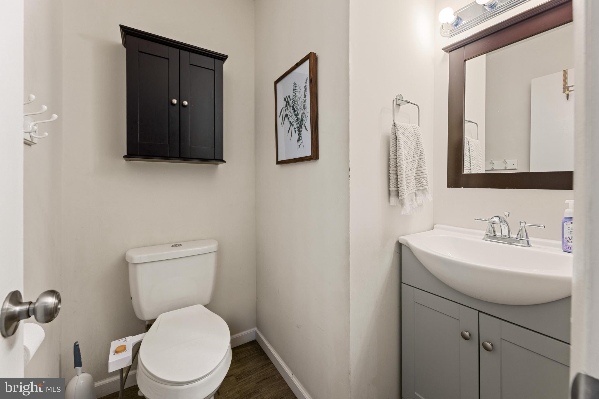 3671 Tavern Way Triangle, VA 22172 - Photo 14 of 18 a bathroom with a toilet sink and mirror