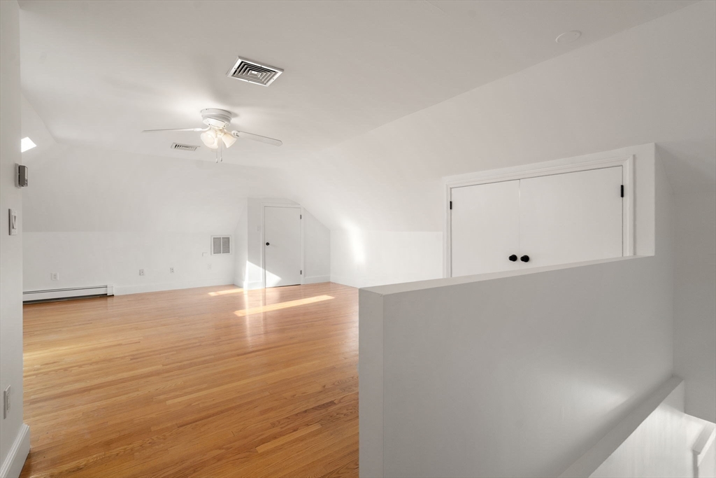215 Ash Street, Unit 3 Waltham, MA 02453 - Photo 11 of 18 a view of empty room with wooden floor