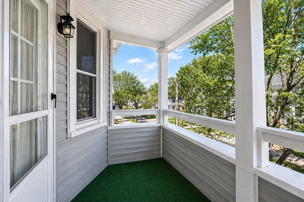 215 Ash Street, Unit 3 Waltham, MA 02453 - Photo 18 of 18 a view of two chairs in balcony