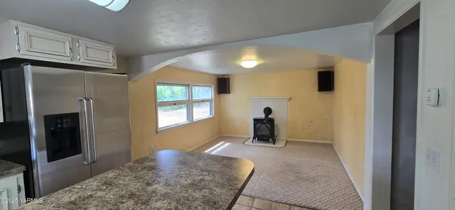 a view of an empty room and window