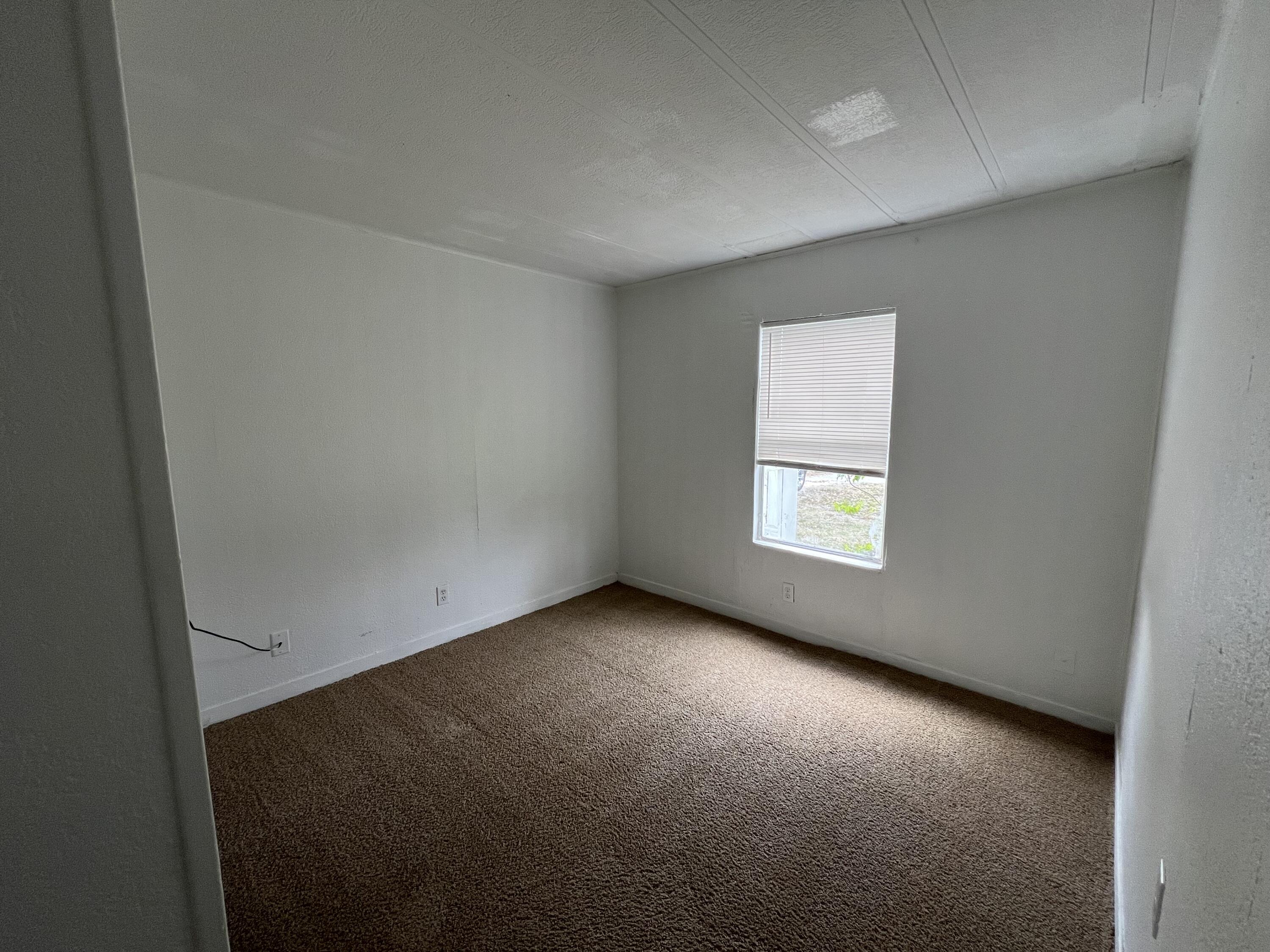 7002 Ash Drive Cocoa, FL 32927 - Photo 13 of 18 an empty room with a window