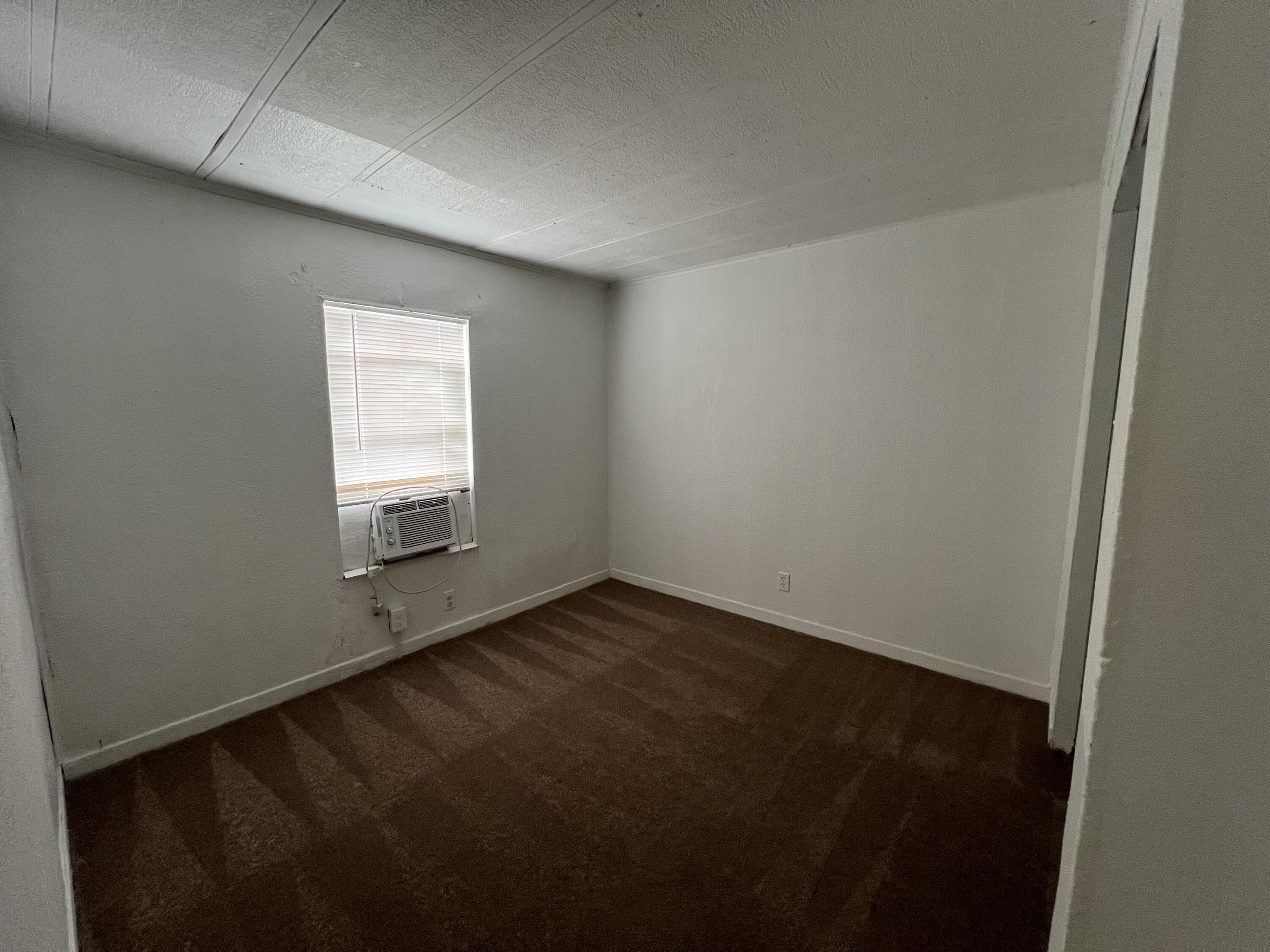 7002 Ash Drive Cocoa, FL 32927 - Photo 14 of 18 an empty room with a window