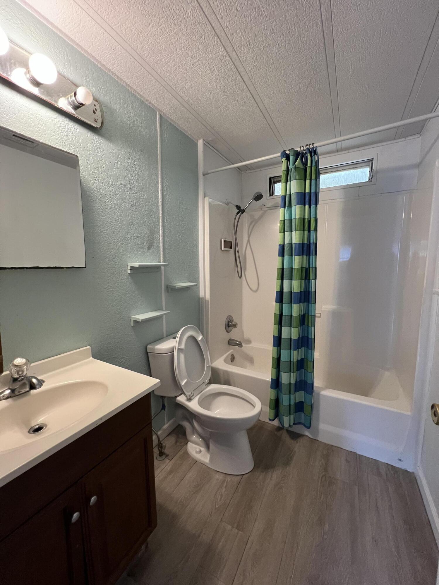 7002 Ash Drive Cocoa, FL 32927 - Photo 15 of 18 a bathroom with a double vanity sink toilet and shower