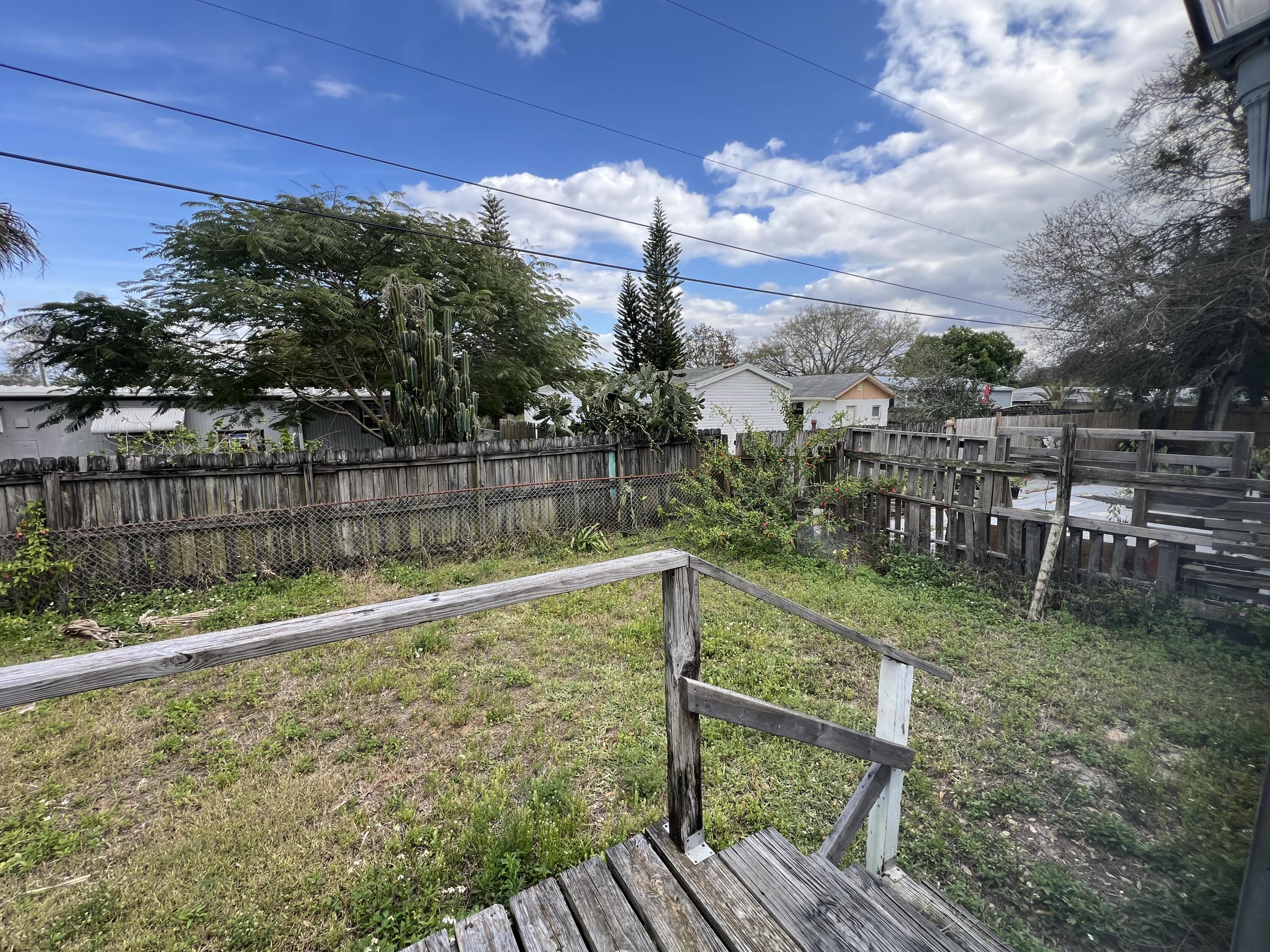 7002 Ash Drive Cocoa, FL 32927 - Photo 17 of 18 a view of a backyard with sitting area