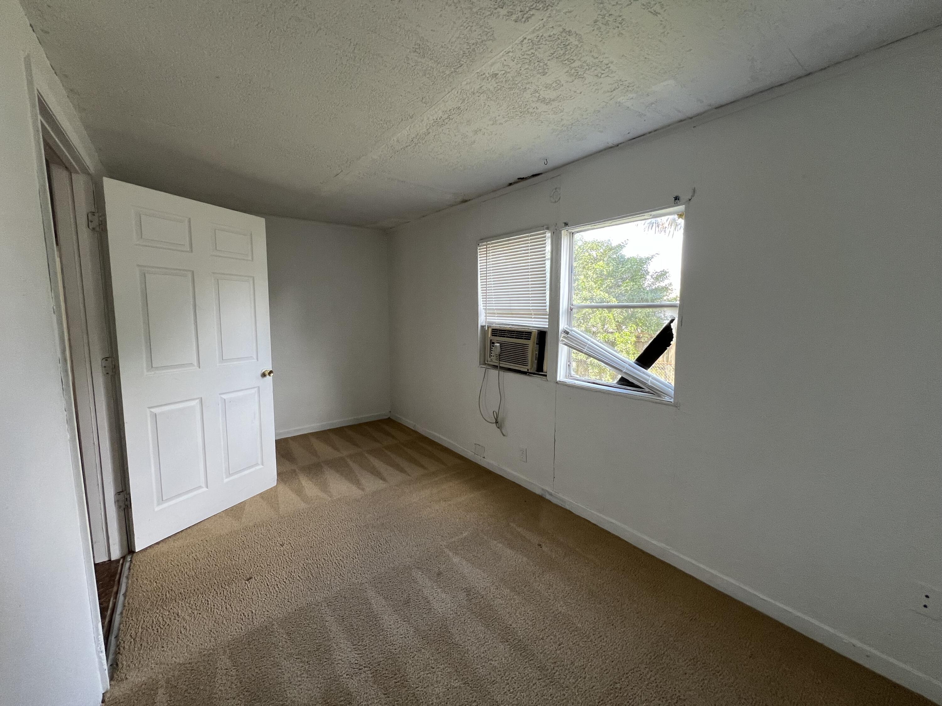 7002 Ash Drive Cocoa, FL 32927 - Photo 6 of 18 an empty room with windows