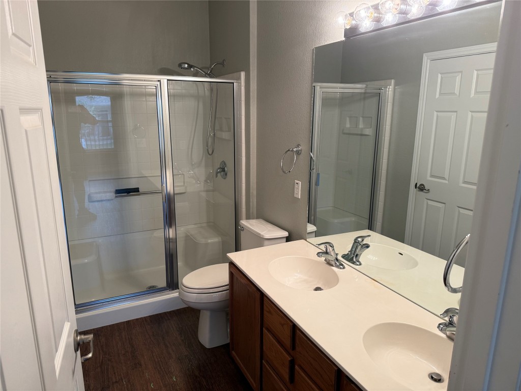 330 Portsmouth Drive Georgetown, TX 78633 - Photo 12 of 16 a bathroom with a sink a toilet and shower