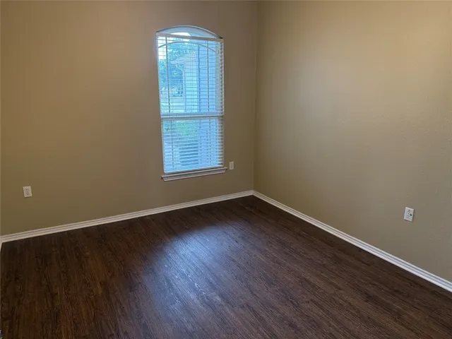 a bathroom with a tub and shower