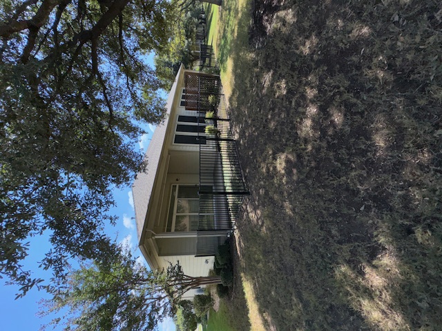 330 Portsmouth Drive Georgetown, TX 78633 - Photo 4 of 16 a view of a house with a tree in a yard