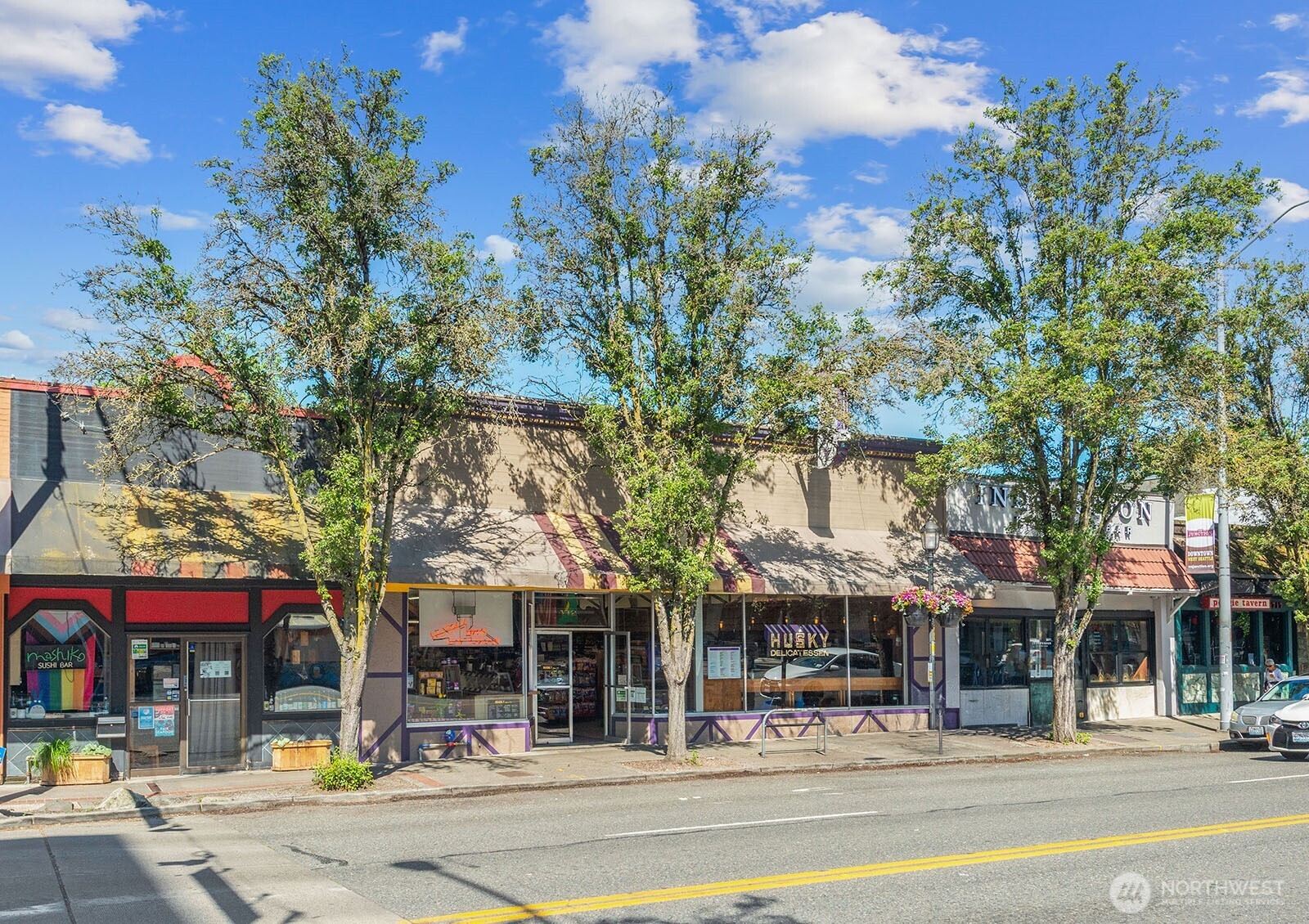 4407 Southwest Alaska Street, Unit 11 Seattle, WA 98116 - Photo 19 of 24 a view of a building and a people on a street