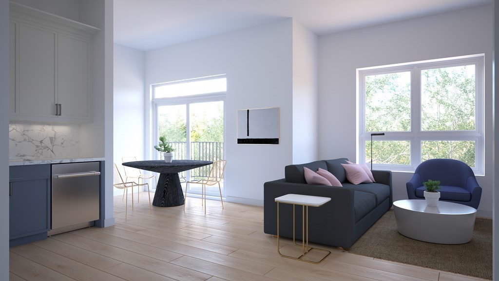301 Border Street, Unit 305 Boston, MA 02128 - Photo 2 of 13 a living room with furniture and a window