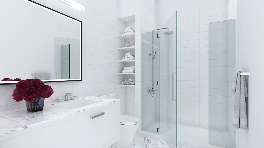 301 Border Street, Unit 305 Boston, MA 02128 - Photo 3 of 13 a bathroom with a sink vanity mirror and toilet