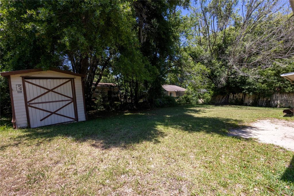 6281 Southeast Hames Road Belleview, FL 34420 - Photo 15 of 16 a view of a backyard