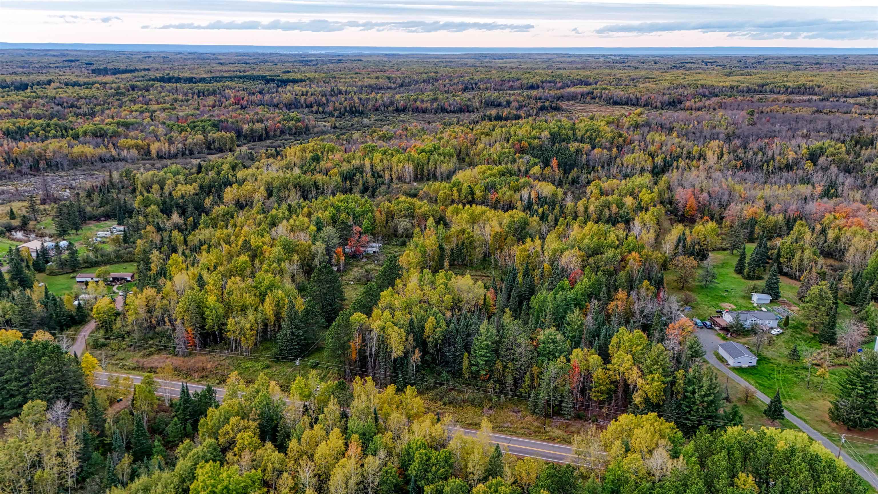 7469 East County Rd B South Range, WI 54874 - Photo 6 of 24 Aerial view of property and surrounding area featuring a forest