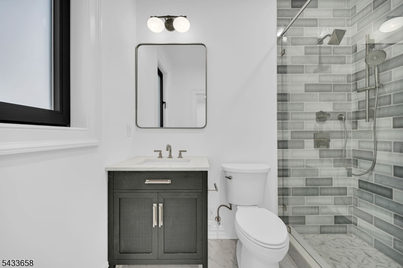 2 Orchard Road Florham Park, NJ 07932 - Photo 17 of 23 a bathroom with a toilet a sink and mirror