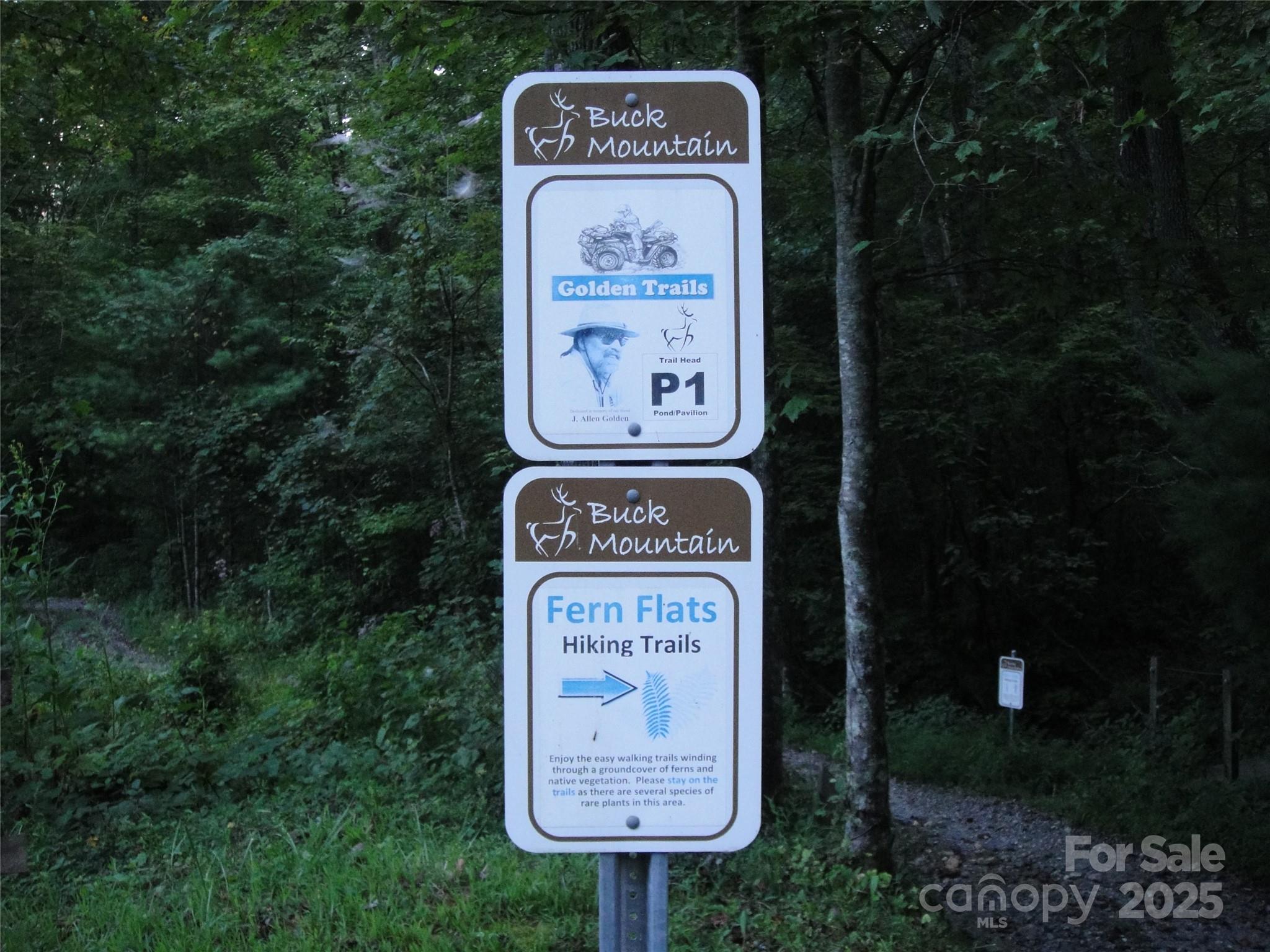 Tbd Wolf Pen Road, Unit 18 Purlear, NC 28665 - Photo 25 of 33 a sign on the side of the road