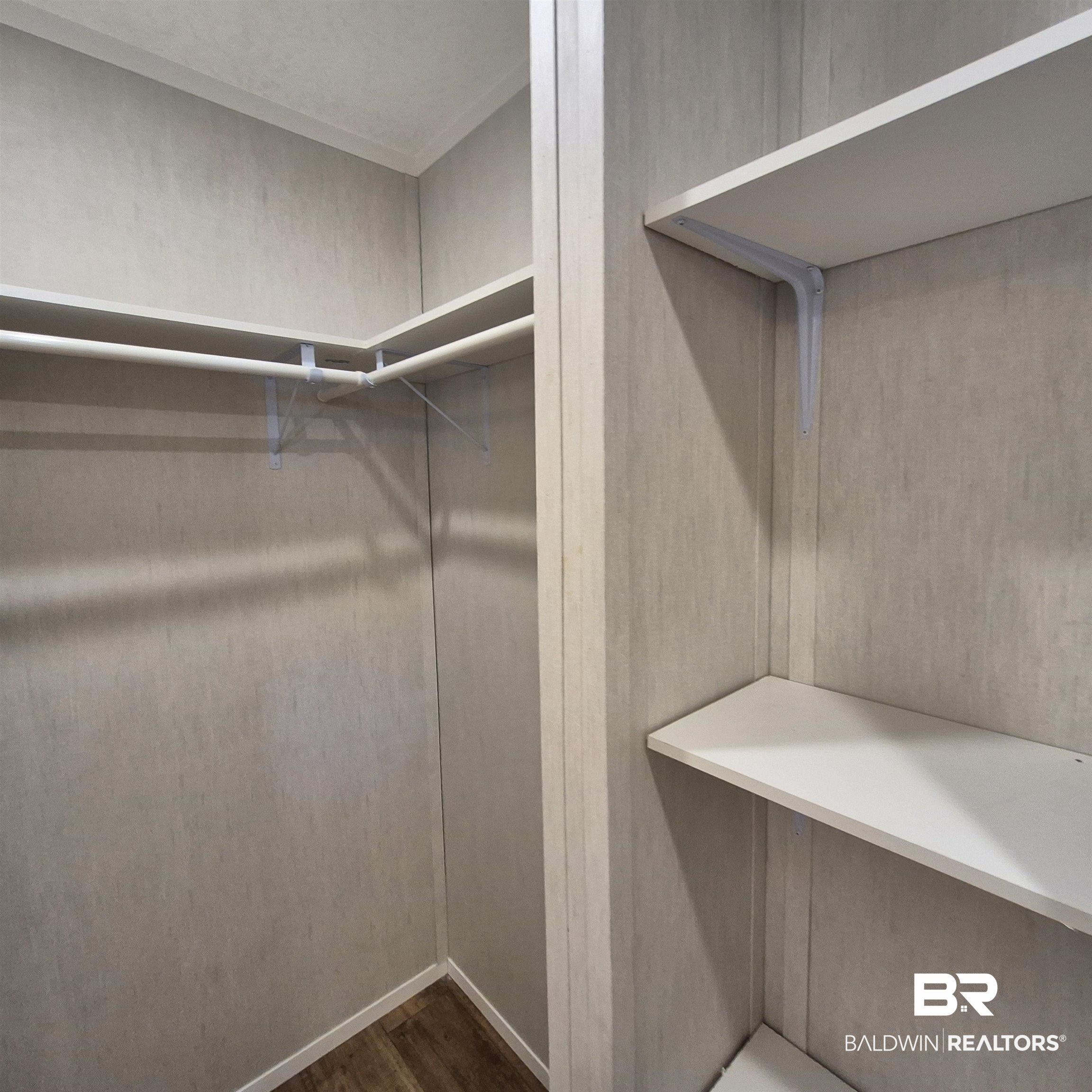 8867 Old Stage Road Repton, AL 36475 - Photo 23 of 37 Walk in closet featuring dark wood-style floors