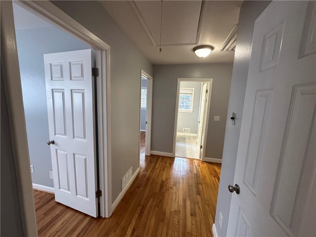 423 Center Circle Southwest Conyers, GA 30094 - Photo 14 of 24 a view of a hallway with wooden floor