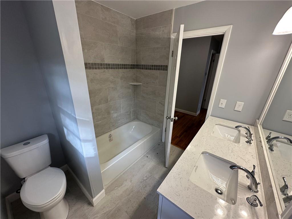 423 Center Circle Southwest Conyers, GA 30094 - Photo 17 of 24 a bathroom with a toilet and a shower