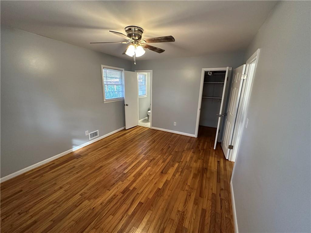 423 Center Circle Southwest Conyers, GA 30094 - Photo 19 of 24 wooden floor in an empty room with a mirror