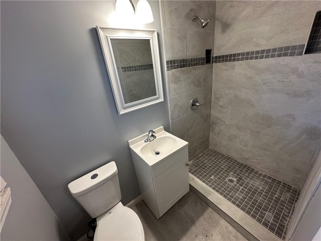 423 Center Circle Southwest Conyers, GA 30094 - Photo 20 of 24 a bathroom with a toilet sink and shower