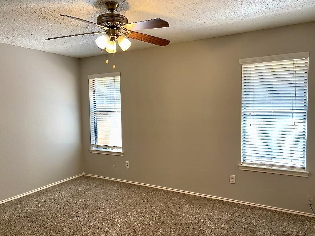 7809 Topawa Cove, Unit B Austin, TX 78729 - Photo 14 of 15 a view of an empty room with a window