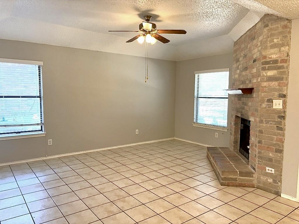 7809 Topawa Cove, Unit B Austin, TX 78729 - Photo 2 of 15 a view of an empty room and window