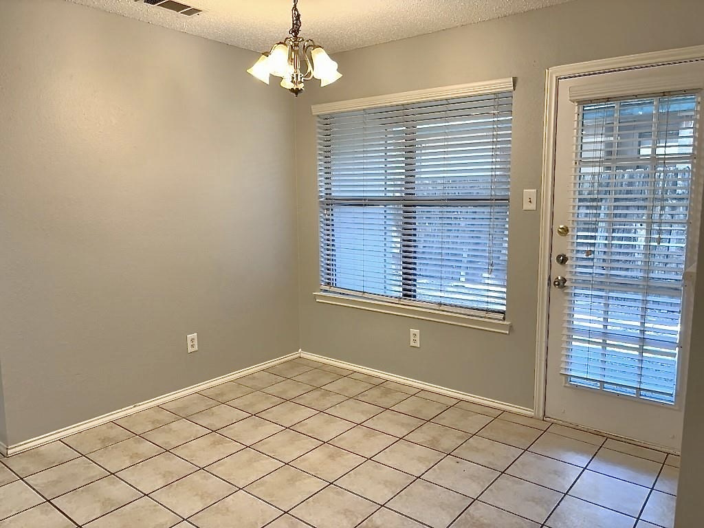 7809 Topawa Cove, Unit B Austin, TX 78729 - Photo 4 of 15 a view of a livingroom with a chandelier fan