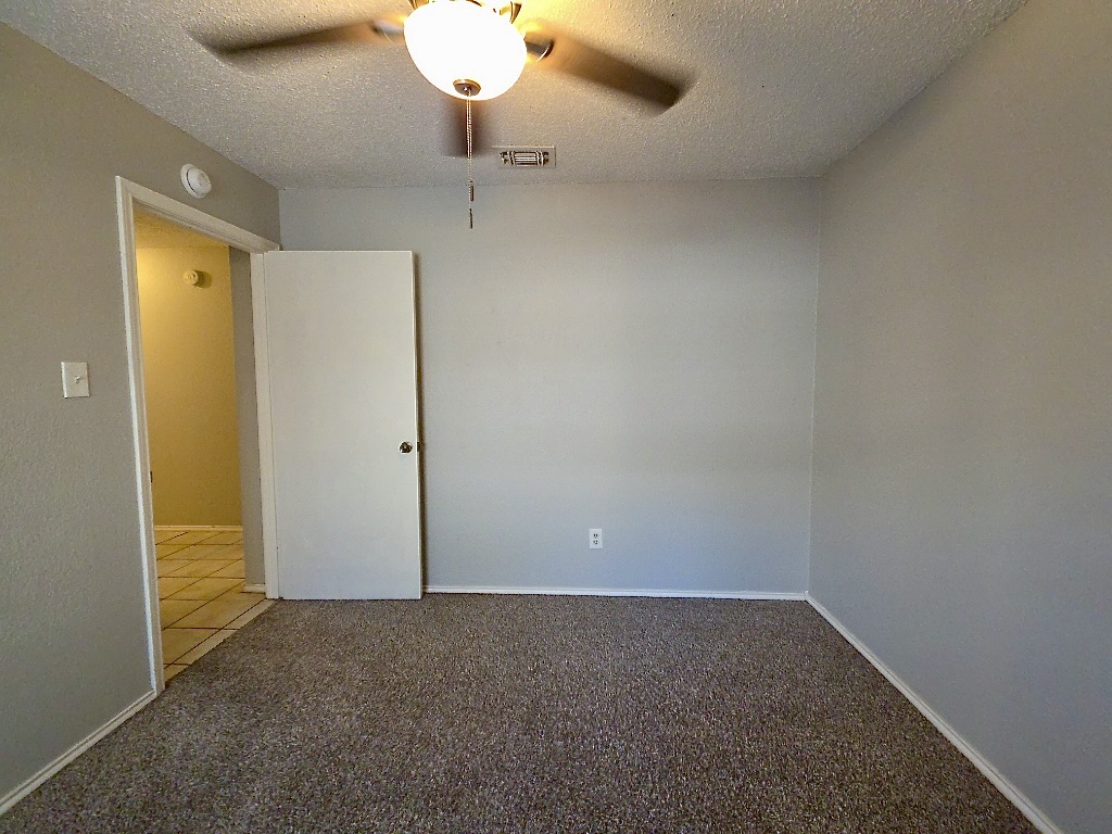 7809 Topawa Cove, Unit B Austin, TX 78729 - Photo 9 of 15 an empty room with a empty space