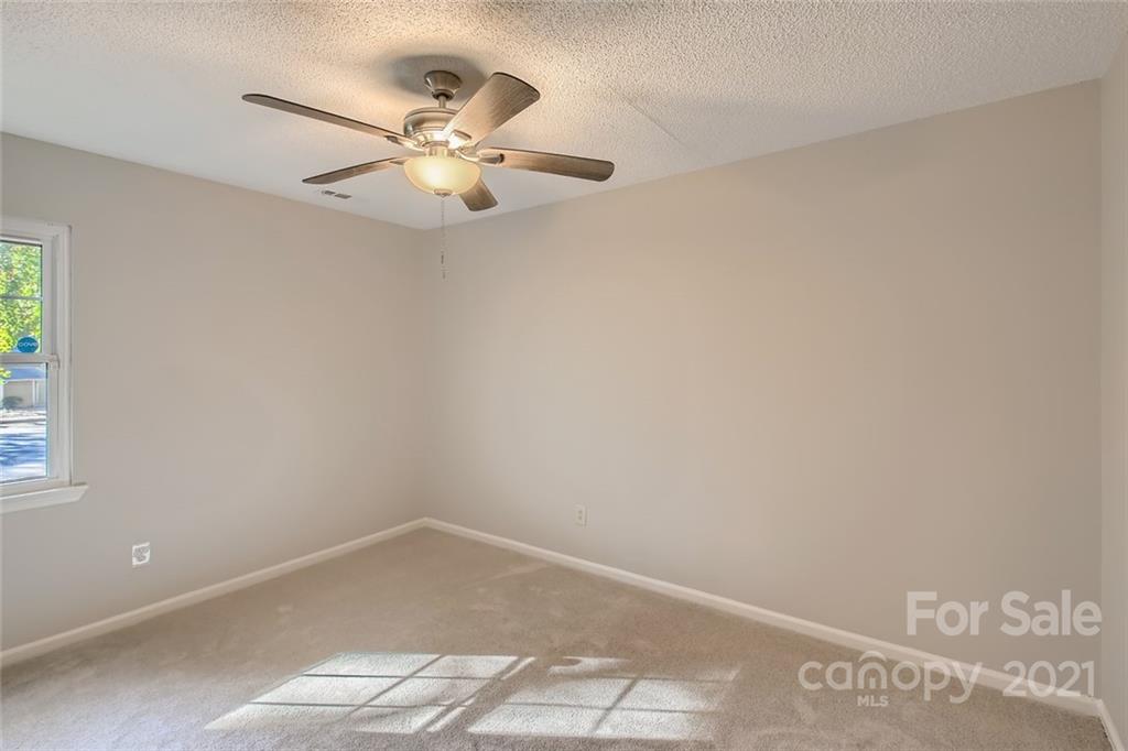 10233 Grand Junction Road Mint Hill, NC 28227 - Photo 11 of 16 an empty room with a window and a fan