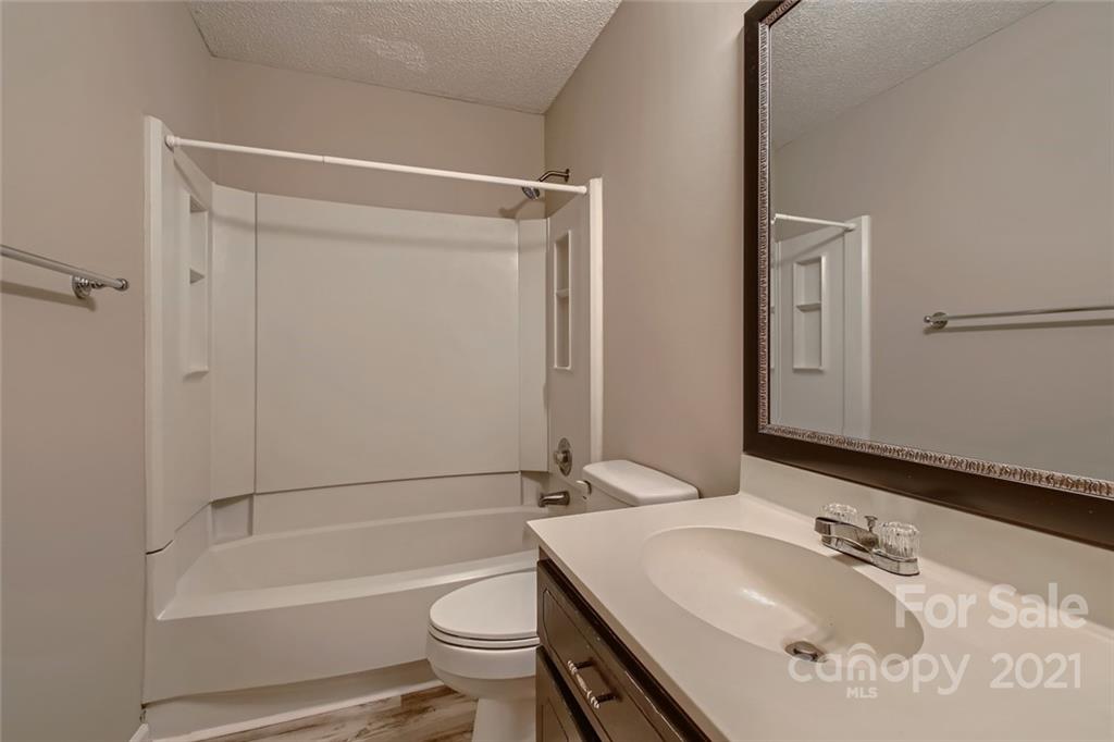 10233 Grand Junction Road Mint Hill, NC 28227 - Photo 13 of 16 a bathroom with a sink toilet and shower