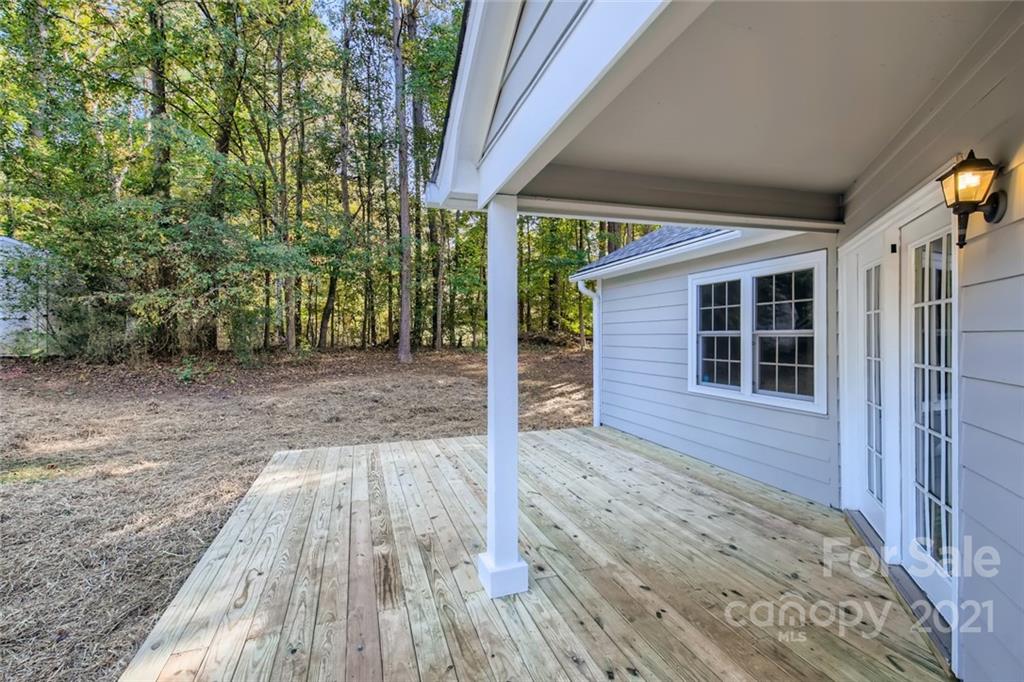 10233 Grand Junction Road Mint Hill, NC 28227 - Photo 14 of 16 a view of front door of house with wooden floor