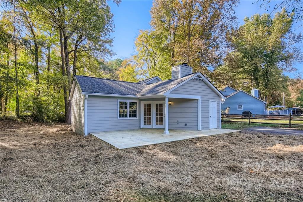 10233 Grand Junction Road Mint Hill, NC 28227 - Photo 15 of 16 a view of a house with a yard and large tree