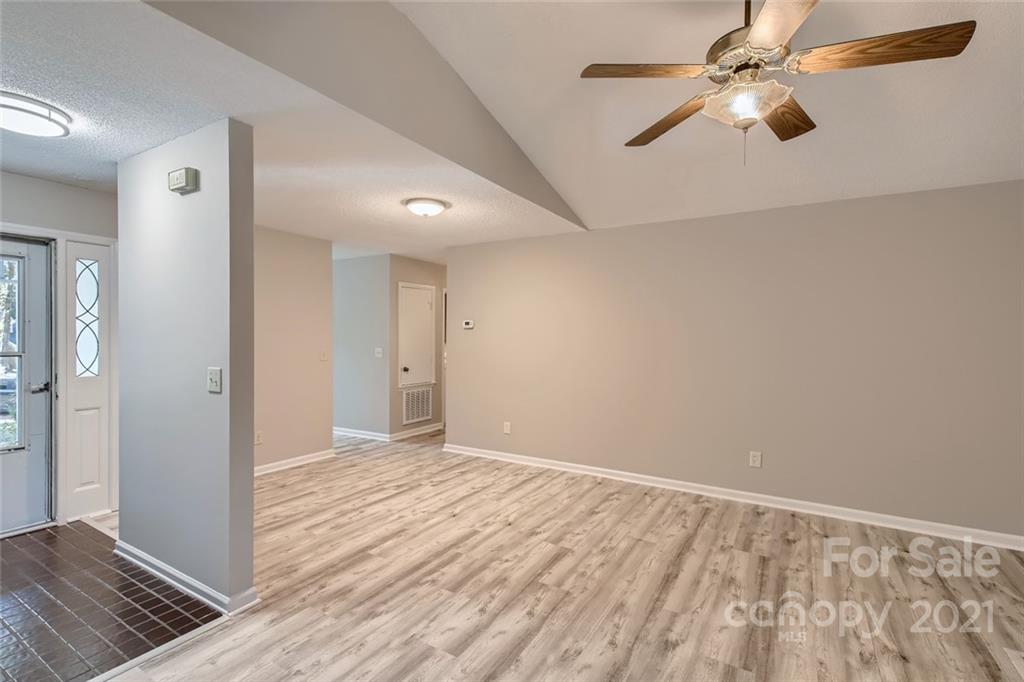 10233 Grand Junction Road Mint Hill, NC 28227 - Photo 5 of 16 wooden floor in an empty room with a window