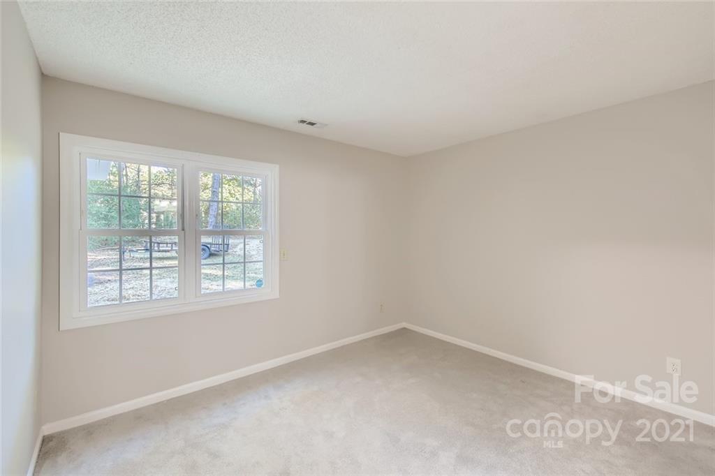 10233 Grand Junction Road Mint Hill, NC 28227 - Photo 8 of 16 an empty room with a window
