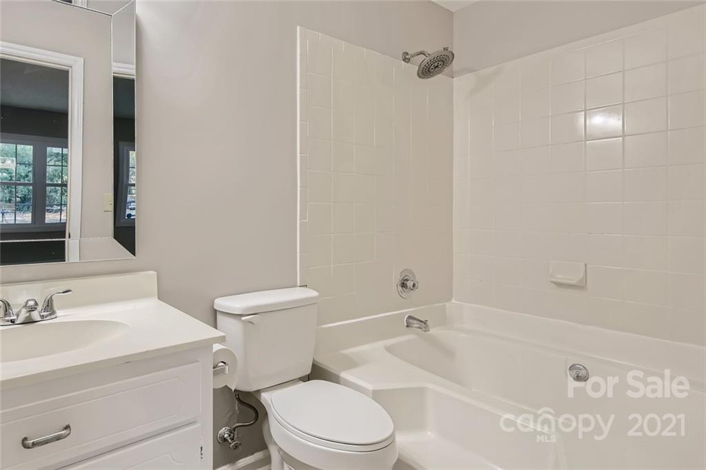 10233 Grand Junction Road Mint Hill, NC 28227 - Photo 10 of 16 a bathroom with a sink a toilet and shower