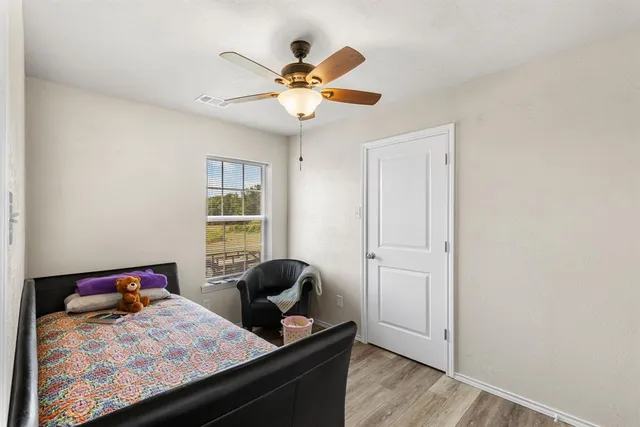 a bedroom with furniture and a window