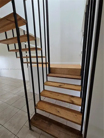 a view of a staircase in a corridor